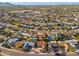 Aerial view of a neighborhood with mature trees, single-Gathering homes, and mountain views at 8656 E Plaza Ave, Scottsdale, AZ 85250