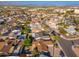 Aerial view of a neighborhood with mature trees, single-Gathering homes, and mountain views at 8656 E Plaza Ave, Scottsdale, AZ 85250