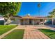 Backyard with mature landscaping, fenced yard and covered patio at 8656 E Plaza Ave, Scottsdale, AZ 85250