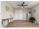 Spacious bedroom with wood floors, a ceiling fan, and ample closet space at 8656 E Plaza Ave, Scottsdale, AZ 85250