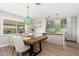 Dining room showing an open floor plan with a view of the updated kitchen at 8656 E Plaza Ave, Scottsdale, AZ 85250