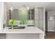 Updated kitchen featuring quartz counters, a modern backsplash, and stylish pendant lights at 8656 E Plaza Ave, Scottsdale, AZ 85250