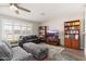 Cozy living room with recessed lights, TV, ceiling fan, and hardwood floors at 8656 E Plaza Ave, Scottsdale, AZ 85250