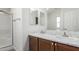 Bathroom features a double vanity with white countertops and a shower at 9431 E Coralbell Ave # 178, Mesa, AZ 85208