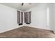 Bedroom with plush carpeting, natural light, and a ceiling fan at 9431 E Coralbell Ave # 178, Mesa, AZ 85208