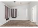 Bedroom with plush carpeting, natural light, and access to the bathroom at 9431 E Coralbell Ave # 178, Mesa, AZ 85208