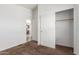 Bedroom showcasing a large closet and doorway to other parts of the home at 9431 E Coralbell Ave # 178, Mesa, AZ 85208
