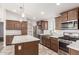 Modern kitchen with an island, stainless steel appliances, and elegant pendant lighting at 9431 E Coralbell Ave # 178, Mesa, AZ 85208