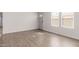 Bright living room with laminate floors, neutral walls, and abundant natural light at 9431 E Coralbell Ave # 178, Mesa, AZ 85208