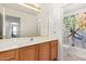Bathroom vanity features wood cabinets, and bright light fixture at 10001 W Potter Dr, Peoria, AZ 85382