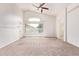 Bright main bedroom featuring high ceilings, ceiling fan, and large windows at 10001 W Potter Dr, Peoria, AZ 85382