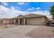 Charming single-story home featuring a desert landscape, covered porch, and attached two-car garage at 10001 W Potter Dr, Peoria, AZ 85382