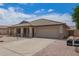 Charming single-story home featuring a desert landscape, covered porch, and attached two-car garage at 10001 W Potter Dr, Peoria, AZ 85382