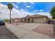 Charming single-story home featuring a desert landscape, covered porch, and attached two-car garage at 10001 W Potter Dr, Peoria, AZ 85382