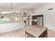 Bright kitchen with stainless steel appliances and views into the living room at 10001 W Potter Dr, Peoria, AZ 85382