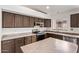 Kitchen featuring brown cabinets, an island and stainless steel appliances at 10001 W Potter Dr, Peoria, AZ 85382