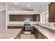 Well-lit kitchen featuring ample counter space, stainless appliances, and tile floors at 10001 W Potter Dr, Peoria, AZ 85382