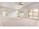 Open living room featuring bright natural light and direct access to the backyard pool at 10001 W Potter Dr, Peoria, AZ 85382