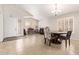 Inviting living room with tiled floors, shutters, a stylish chandelier, and a dining set for a cozy feel at 10001 W Potter Dr, Peoria, AZ 85382