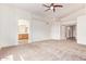 Spacious main bedroom features a ceiling fan, an ensuite bathroom and closet at 10001 W Potter Dr, Peoria, AZ 85382