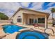 Backyard pool with connected spa and covered patio at 10001 W Potter Dr, Peoria, AZ 85382