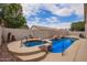 Backyard pool and spa features a rock waterfall feature at 10001 W Potter Dr, Peoria, AZ 85382