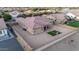 A bird's eye view of the backyard including desert landscaping, patio, and privacy fence at 19011 E Carriage Way, Queen Creek, AZ 85142
