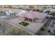 A bird's eye view of the backyard including desert landscaping, patio, and privacy fence at 19011 E Carriage Way, Queen Creek, AZ 85142