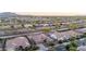 Expansive aerial view of a neighborhood featuring well-maintained homes and desert landscaping at 19011 E Carriage Way, Queen Creek, AZ 85142