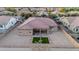 A bird's eye view of the backyard including desert landscaping, patio, and privacy fence at 19011 E Carriage Way, Queen Creek, AZ 85142