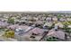 High-angle view captures a residential community with orderly homes and landscaping, promoting a peaceful neighborhood at 19011 E Carriage Way, Queen Creek, AZ 85142