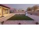 A barbecue area sits on a low-maintenance backyard, complemented by a covered patio for easy entertaining at 19011 E Carriage Way, Queen Creek, AZ 85142