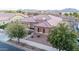 Charming single-story home featuring a well-kept landscape and a welcoming entrance at 19011 E Carriage Way, Queen Creek, AZ 85142