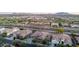 An eye-level shot of the property featuring the house and surrounding neighborhood at 19011 E Carriage Way, Queen Creek, AZ 85142