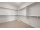 Spacious walk-in closet with built-in shelving, offering ample storage space at 21277 N 272Nd Ave, Buckeye, AZ 85396