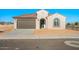 Charming single-Gathering home featuring a brown garage door, a red-tiled roof, and neutral-colored stucco at 21277 N 272Nd Ave, Buckeye, AZ 85396