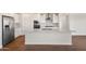 Modern kitchen featuring stainless steel appliances, white cabinetry, and a center island at 21277 N 272Nd Ave, Buckeye, AZ 85396