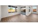 Bright and airy living room with wood-look floors and lots of natural light at 21277 N 272Nd Ave, Buckeye, AZ 85396