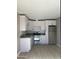 Contemporary kitchen featuring white cabinetry and stainless steel appliances at 4418 N 34Th Dr, Phoenix, AZ 85017