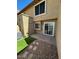 Private backyard with patio, artificial turf, and easy access to the home at 4601 N 102Nd Ave # 1100, Phoenix, AZ 85037