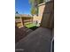 The backyard features an artificial grass area and a concrete patio at 4601 N 102Nd Ave # 1100, Phoenix, AZ 85037