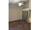 Bedroom with plush carpet, ceiling fan and closet with sliding doors at 4601 N 102Nd Ave # 1100, Phoenix, AZ 85037