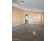 Open-concept living room with tile flooring, neutral walls, and recessed lighting at 11363 W Locust Ln, Avondale, AZ 85323