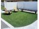 Outdoor area with artificial grass and seating; perfect for relaxing and entertaining at 127 E Pershing Ave, Phoenix, AZ 85022