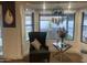 Cozy seating area with bay window, chair and contemporary decor and view of the backyard at 127 E Pershing Ave, Phoenix, AZ 85022