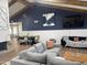 Bright living area showcasing wood beams, a vaulted ceiling and a comfortable sectional sofa at 127 E Pershing Ave, Phoenix, AZ 85022