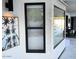 Windows that provide natural light to outdoor patio area with decorative art at 127 E Pershing Ave, Phoenix, AZ 85022