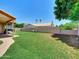 Green backyard with patio at 1347 W Straford Ave, Gilbert, AZ 85233