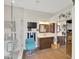 A bathroom with a glass enclosed shower, TV, vanity, mirrors, and closet at 1347 W Straford Ave, Gilbert, AZ 85233