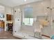 A bathroom with a glass enclosed shower and a chair at 1347 W Straford Ave, Gilbert, AZ 85233
